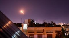 File photo from 20 July 2020 showing Syrian air-defence missile fired from near Damascus during Israeli air strikes
