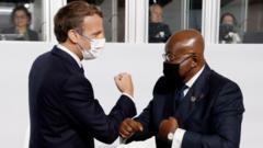 France President Emmanuel Macro dey arm greeting wit Ghana President Nana Akufo-Addo