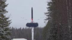 A Russian Yars intercontinental ballistic missile is launched during the exercises by nuclear forces in an unknown location in Russia, in this still image taken from video released February 19, 2022.