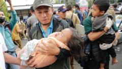Rescuers and a mother carry the body of a boy, victim of the earthquake that hit Cianjur, Indonesia, 21 November 2022.