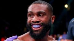 ‘Future of boxing’ Ennis retains welterweight title