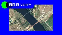 An annotated satellite image taken on 6 May showing the new road bridge and the existing rail bridge. It is imposed over the BBC Verify colours and branding. 