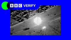 Footage of an airstrike against rebel vehicles in Mali. It is imposed over the BBC Verify colours and branding. 