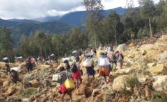 Desperate search for hundreds after massive landslide