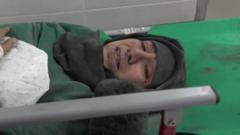 A woman lying on a hospital bed