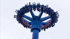 People left dangling upside down on amusement park ride