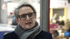 Conservative candidate Charlotte Cadden, wearing black rimmed glasses and a scarf round her neck