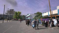 UNRWA school with smoke rising in the background