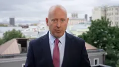 BBC Russia editor in a suit