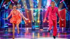 Amber Davis and Nikita Kuzmin during a live show on BBC1's Strictly Come Dancing