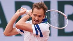 Medvedev into third round after Kecmanovic retires