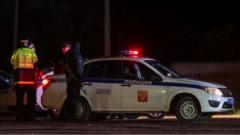 Russian police next to a police car