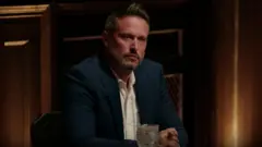 Kieran sitting at the Traitors roundtable