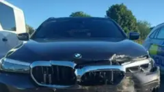 The unmarked police car was left with £10,000-worth of damage