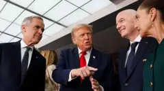 US President Donald Trump, Mexican President Claudia Sheinbaum and Canada's Prime Minister Mark Carney during the trophy presentation at the World Cup