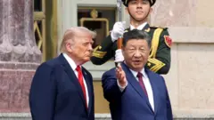 U.S. President Donald Trump and Chinese President Xi Jinping attend a welcome ceremony at the Great Hall of the People on May 14, 2026 in Beijing, China. 
