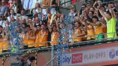 Hull players lift the trophy after winning the Championship play-offs at Wembley