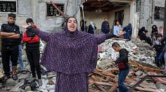 A Palestinian woman reacts in front of a destroyed building, belonging to Abu Jazar family, following the Israeli attacks in Rafah, Gaza on November 15, 2023. It is stated that there were many injured and dead peopleany buildings in the area were heavily damaged