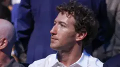 Mark Zuckerberg, wearing a white collared shirt while sitting in a crowd at the recent UFC event at the White House. 
