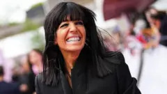 Claudia Winkleman smiling on the red carpet