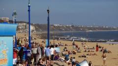 People enjoying the sun at Bournemouth beach.
