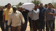 Pallbearers carrying Abdelbaset al-Megrahi's coffin