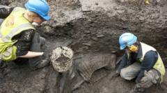 Archaeologists dig at the site in London