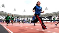 children running in Olympic stadium