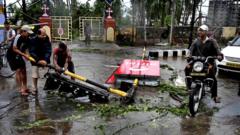 Indian residents clear up cyclone damage