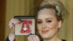 Adele with her MBE