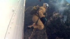 Smokejumper leaping from a plane