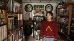 Asher Silva Vargas at home with his 3097 pieces of Harry Potter memorabilia
