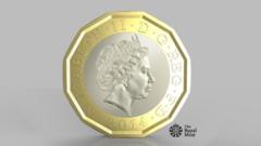 The new pound coin design. A twelve sided coin in gold, with a silver disc inset. The Queen features prominently.