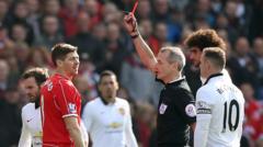 Steven Gerrard is shown the red card by referee Martin Atkinson