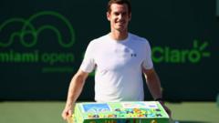 Andy Murray holding cake