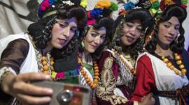 Young Amazigh (Berber) women pose for a selfie photograph during the annual "Engagement Moussem" festival near the village of Imilchil in central Morocco's high Atlas Mountains on September 21, 2019. - Each year in the High Atlas Mountains hamlet of Ait Amer, tribes celebrate with dances and music, the collective wedding of young Amazigh couples during the traditional festival of "Engagement Moussem"