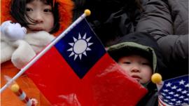 A child holds the ROC flag during a parade in DC's Chinatown.