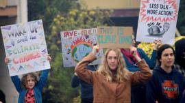 Protesters rally outside as New South Wales Premier Gladys Berejiklian meets with Rural Fire Service Deputy Commissioner Rob Rogers at the Blue Mountains Fire Control Centre in Katoomba, Australia,