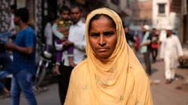 Mushtari Khatoon standing in a street