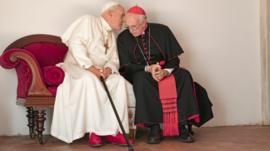 Hopkins and Pryce as the two popes sitting together