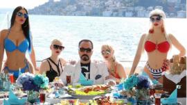 Adnan Oktar posing on a terrace by the Bosphorus in Istanbul