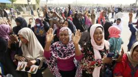 Sudanese people celebrate as they head towards the Army headquarters amid rumors that President Omar al-Bashir has stepped down, in Khartoum, Sudan, 11 April 2019