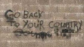Racist graffitti saying 'Go back to your' country' 