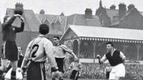 Goalkeeper jumping for ball in an archive photo of a football match at Great Yarmouth