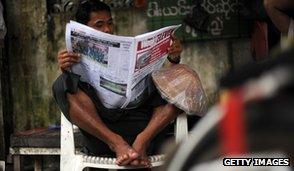 Newspaper reader, Burma, 2012