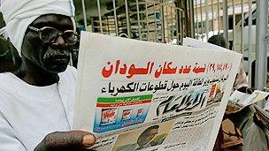Newspaper reader in Sudan