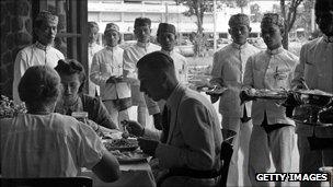 circa 1940: Dutch colonialists eating in Java