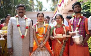 Mr Reddy (left) with his daughter and other family members