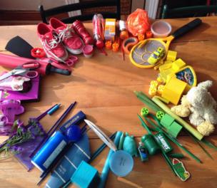 Colourful objects laid out on a table in a circle