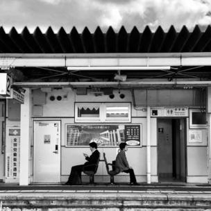 Waiting at a train station in Japan